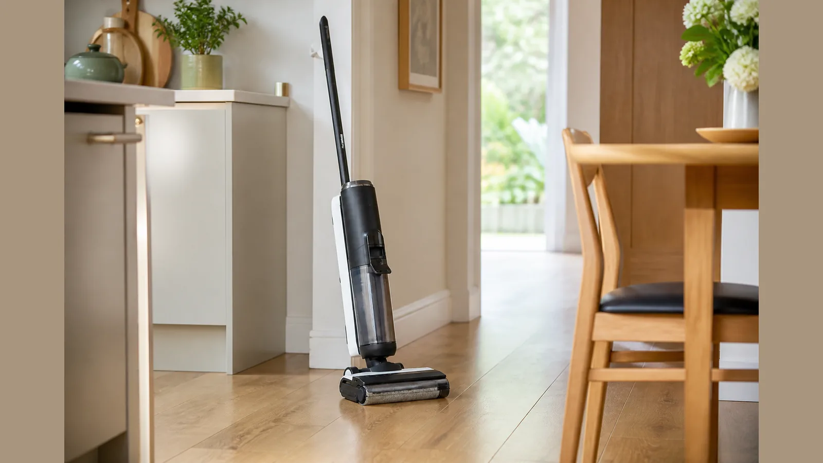 Cordless vacuum mop parked on sealed hard flooring in a bright UK kitchen